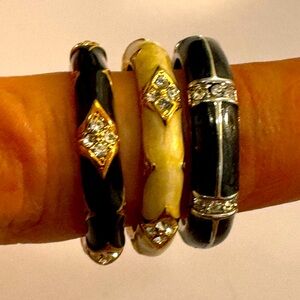 Set of three enamel rings with embellishments